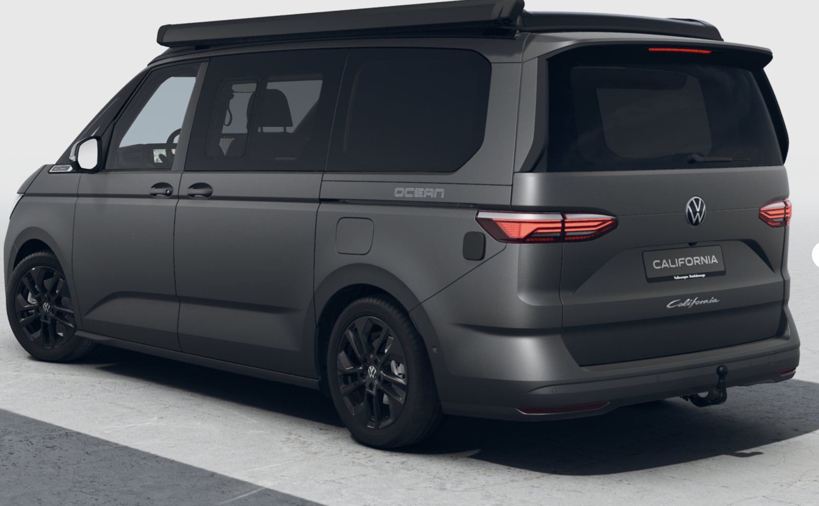 Rear three-quarter view with tailgate and tow bar